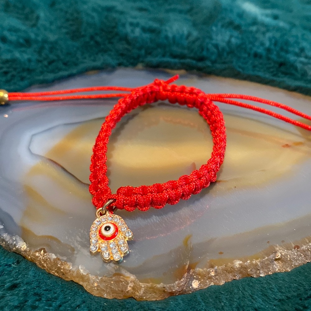 Red and gold hand and evil eye bracelet